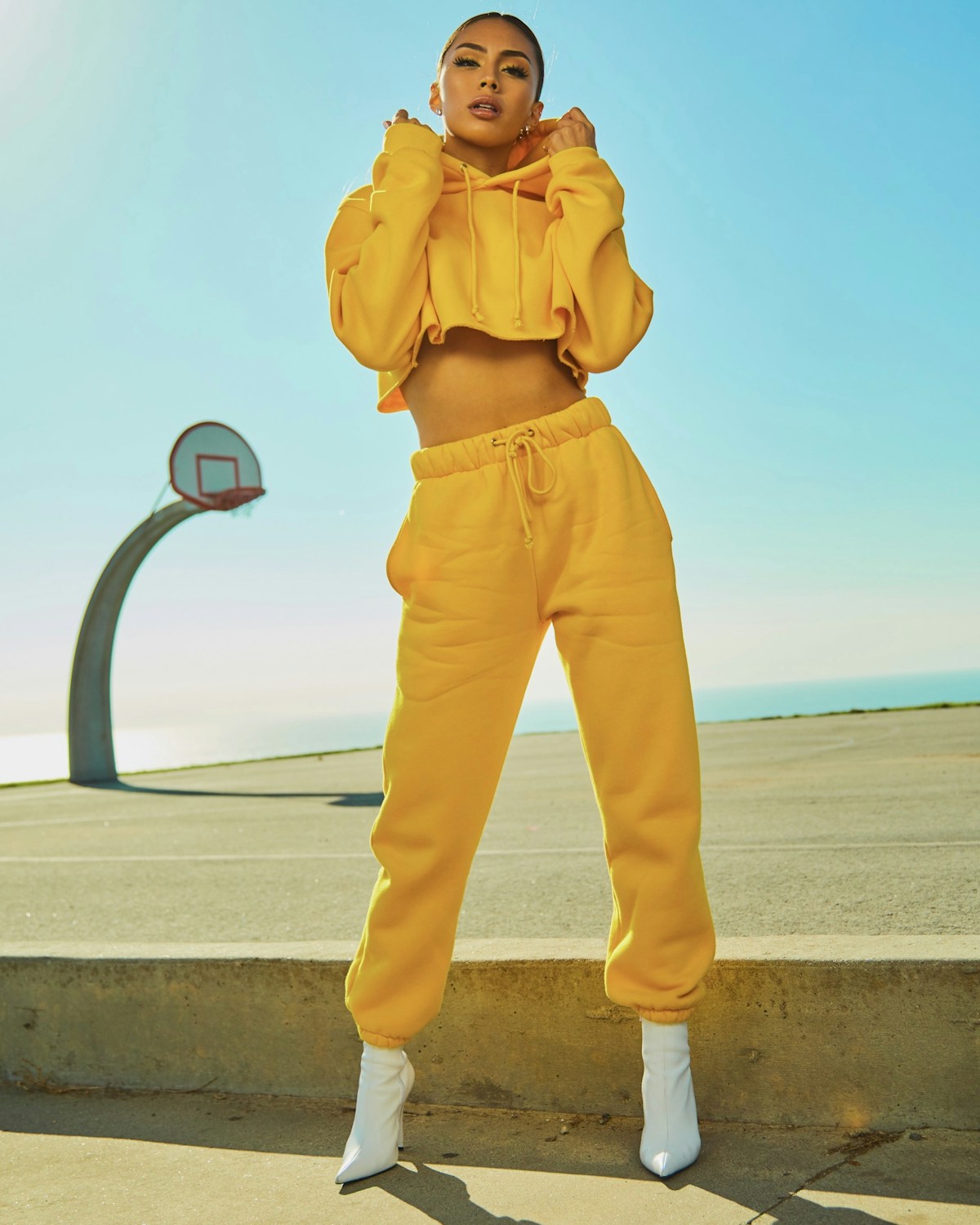 Model wearing minimalist streetwear in urban setting